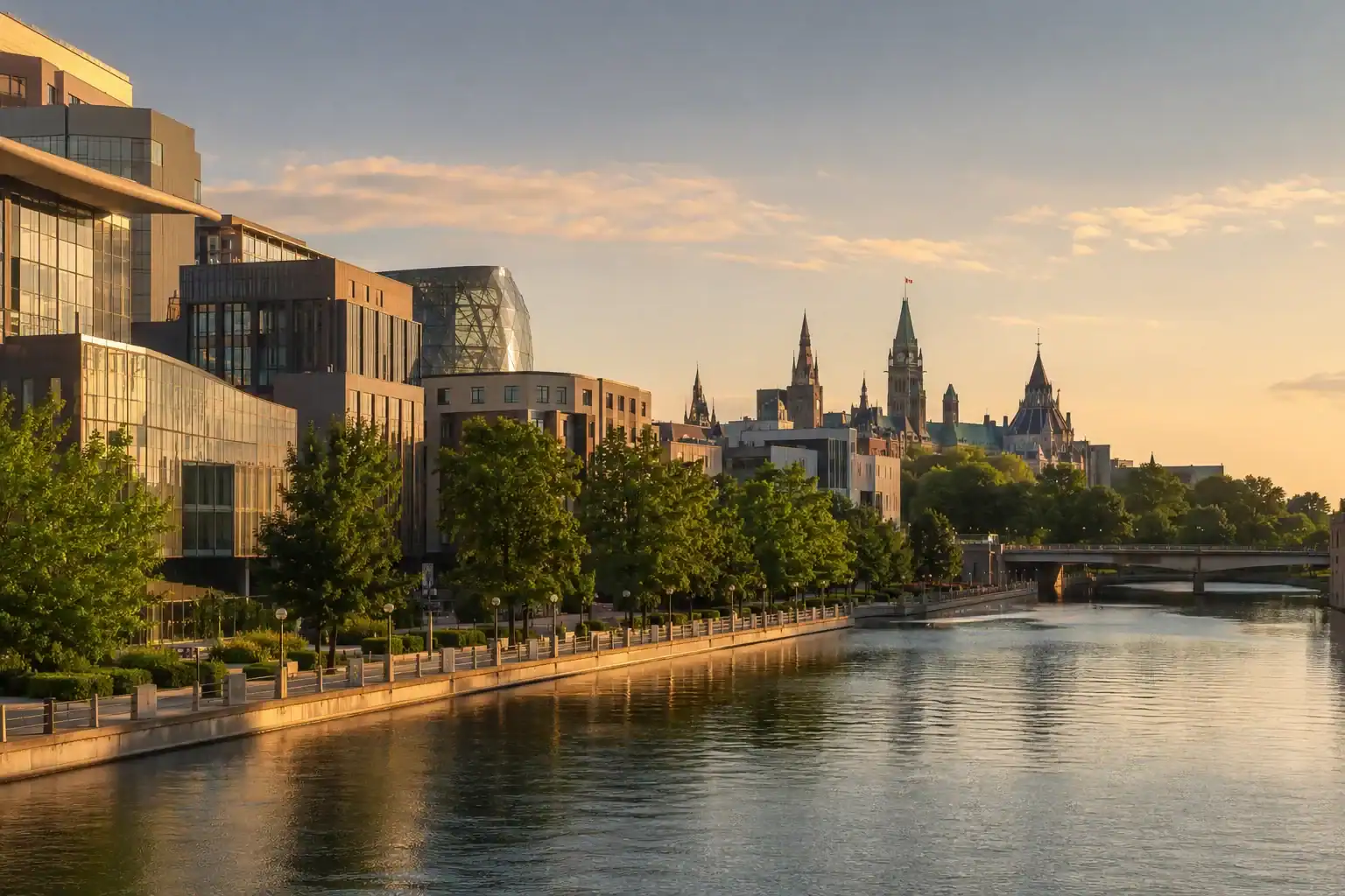 Modern buildings and trees line a riverside walkway at sunset, showcasing the city’s blend of innovation and tradition—qualities reflected in any leading Ottawa web design company. In the background, historic Gothic-style towers and a bridge stand beneath a partly cloudy sky, evoking both classic charm and contemporary dynamism much like Ottawa WordPress development seamlessly connects timeless architecture with modern technology. - Clio Websites | Top Canadian Web Design Company